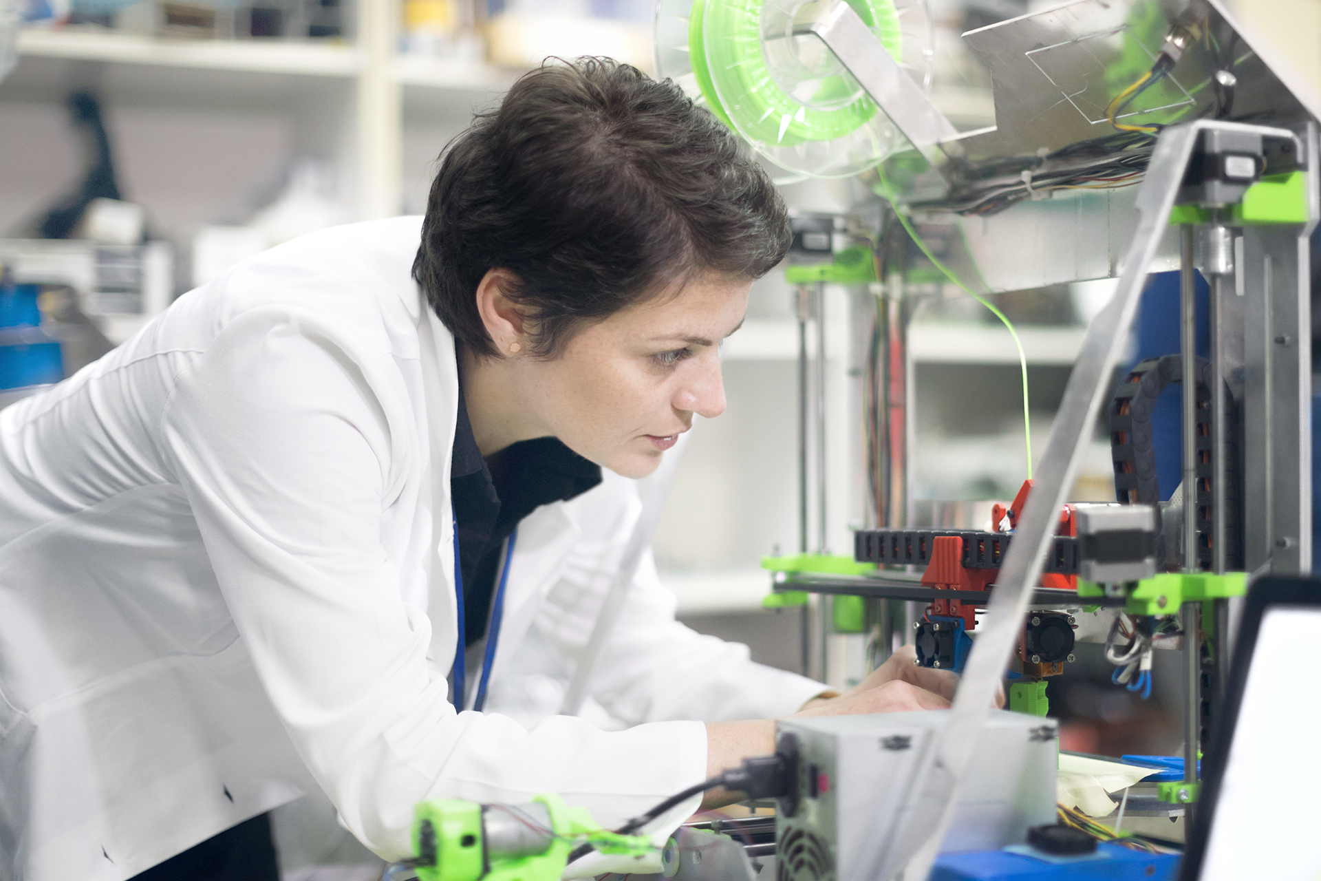 Woman using a 3D printer